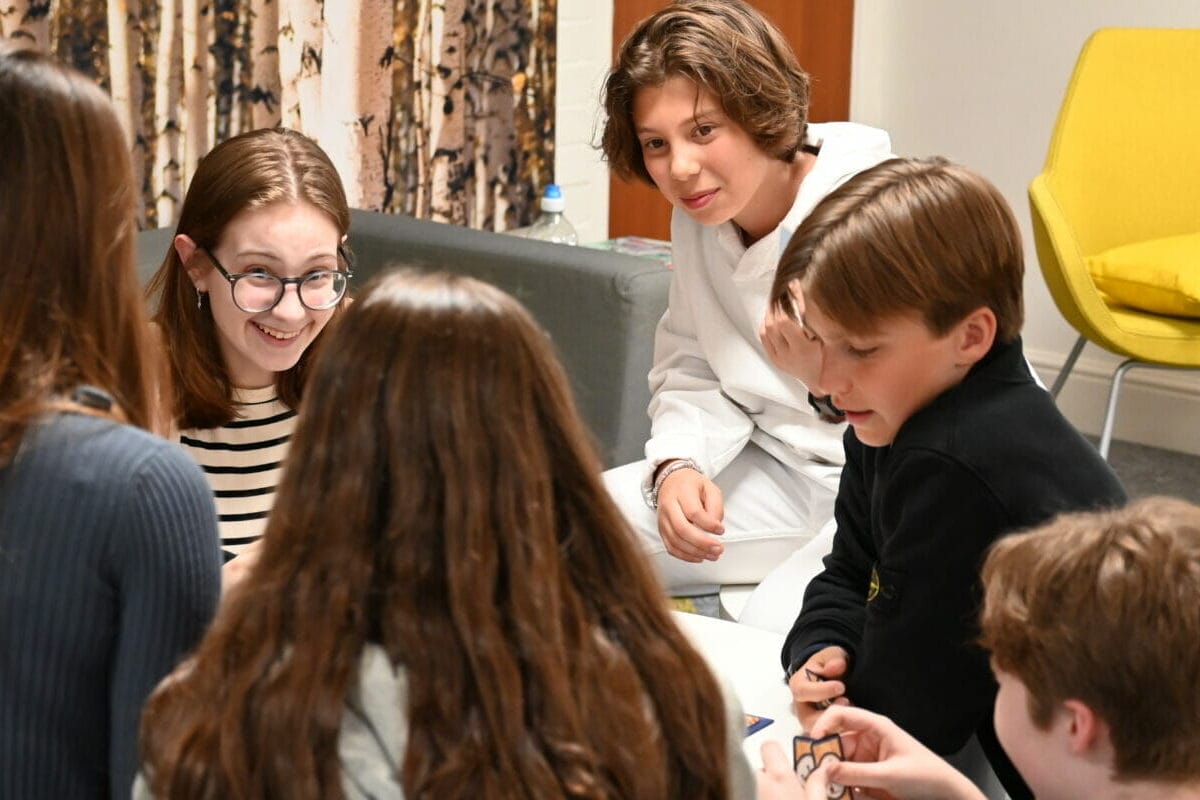 children playing a card game